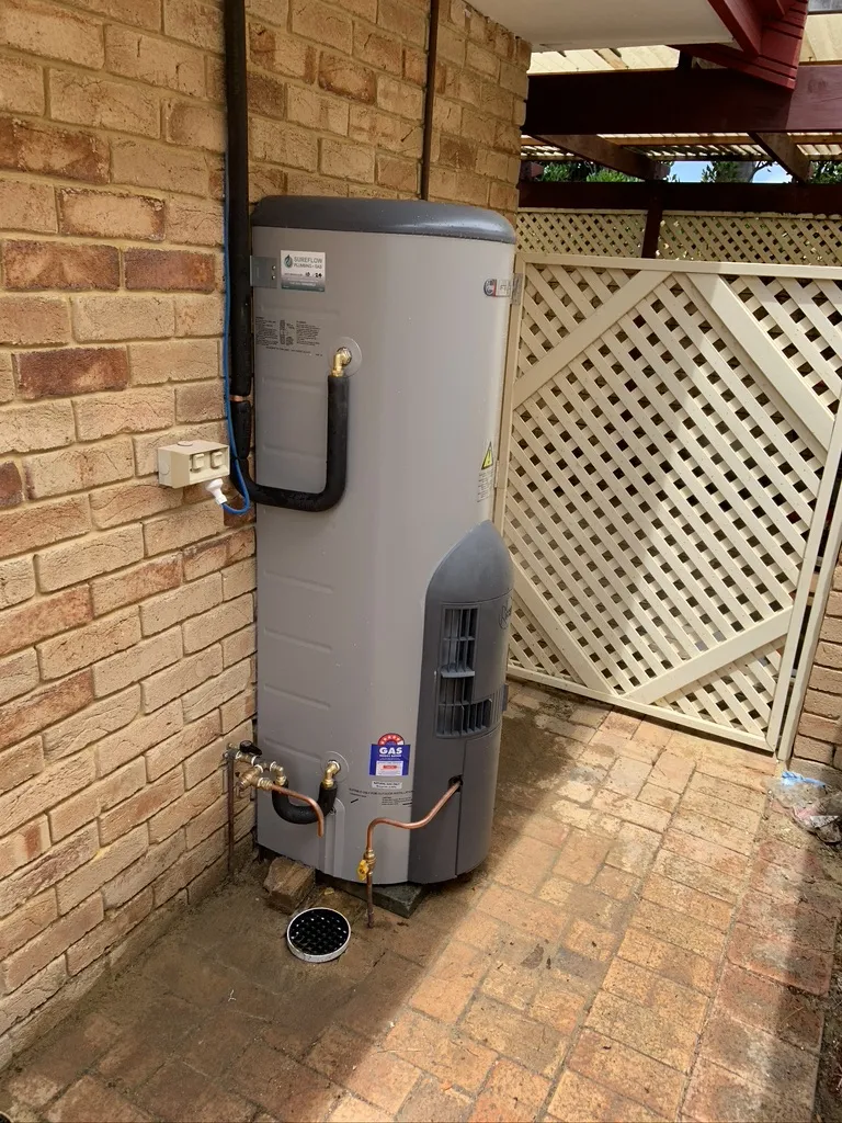 A storage hot water system installed by Sureflow in a Perth courtyard